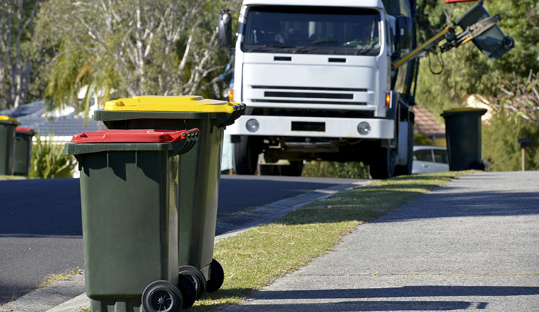 Council bins being collected on residential street