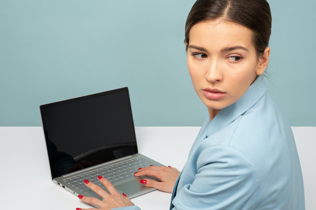 Office worker uses laptop computer