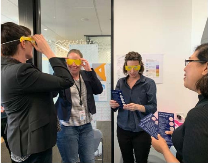 NSW Department of Customer Service staff wear Vision Australia’s sight impairment simulator glasses during a visit to the empathy lab