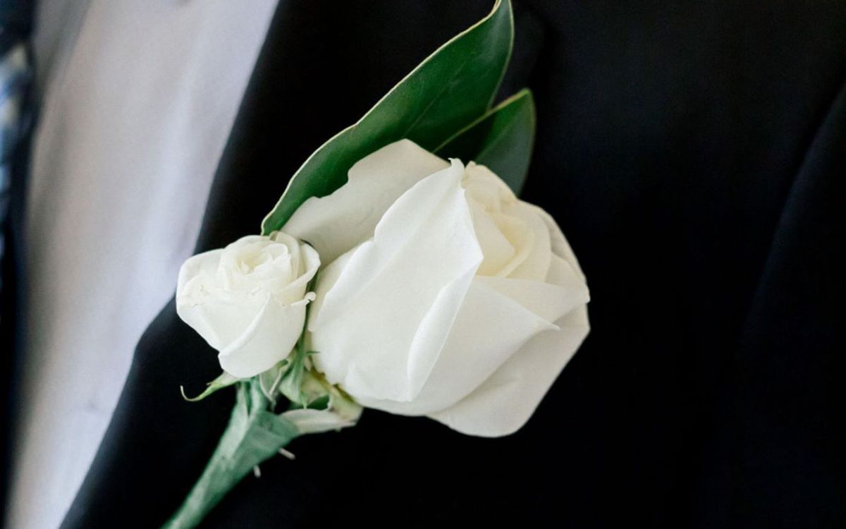 White rose for groom's buttonhole