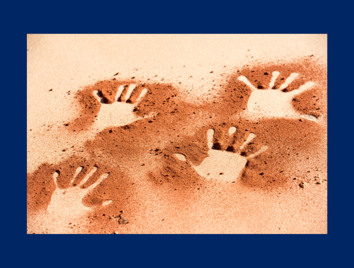 hand prints in sand