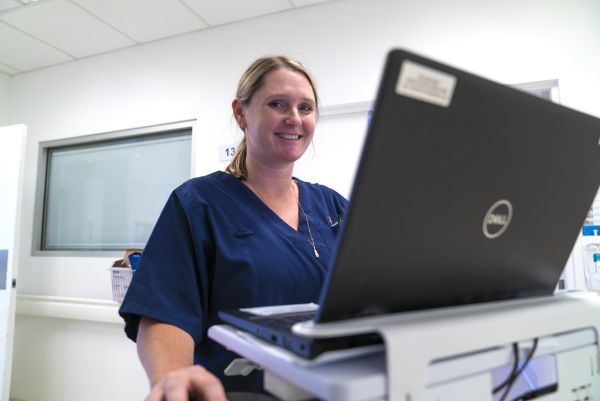 A nurse with her laptop computer