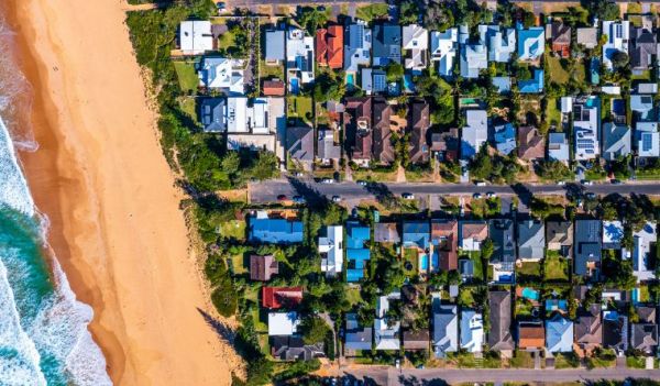 Aerial view of houses near a beach