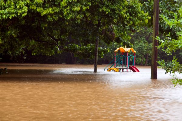 Children's play equipment inundated by flood water
