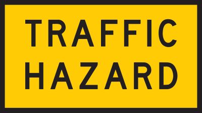 Traffic hazard on road ahead. Drive with caution