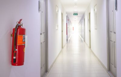 Image of a fire extinguisher in a hallway