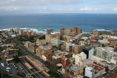 Aerial view of Newcastle City Centre with Pacific Ocean in the distance.