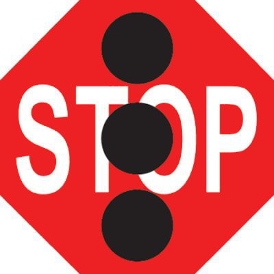 Road sign with 'Stop' and 3 black dots