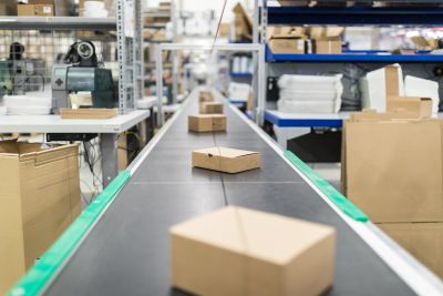 Image of parcels on a conveyor belt in warehouse