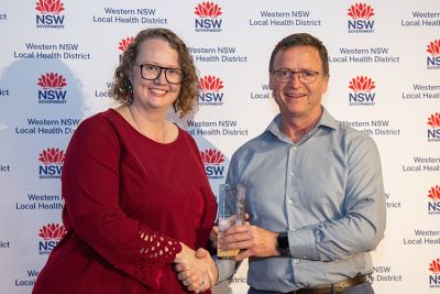 Member of the Aged Care team accepting the Transforming Patient Experience Award for their project, Seeing the individual story before the waitlist