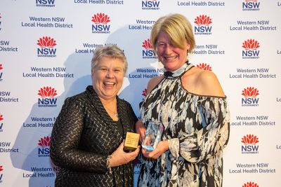 Alison Loudon accepting the Excellence in Aboriginal Healthcare Award for the Welcome Baby to Bourke Ceremony initiative