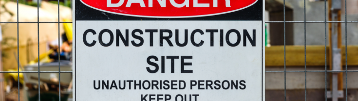 A danger construction sign outside a building site