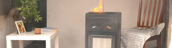 A demonstration of a gas heater catching on fire in a home