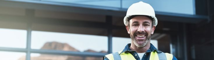 Man smiling in a hard hat