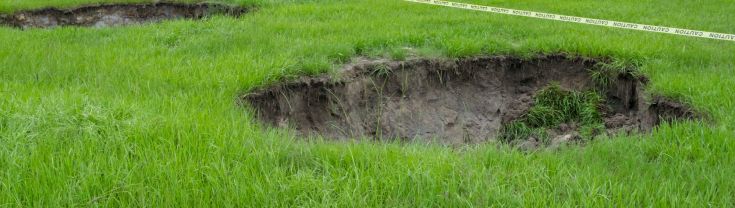 Sinkholes in a grassy field 
