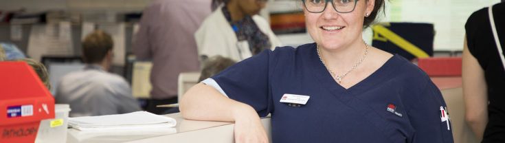 Nurse smiling working in a hospital