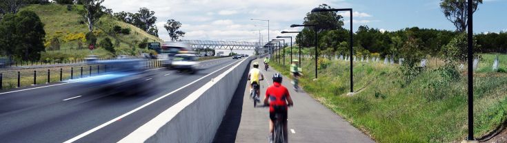 SmartInfrastructureDesignSpecifications.jpg Alt Text: Several cyclists ride along a pathway alongside a road, with the cyclists and cars blurred to show they're moving.