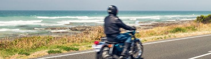 Motorbike rider on the coastline
