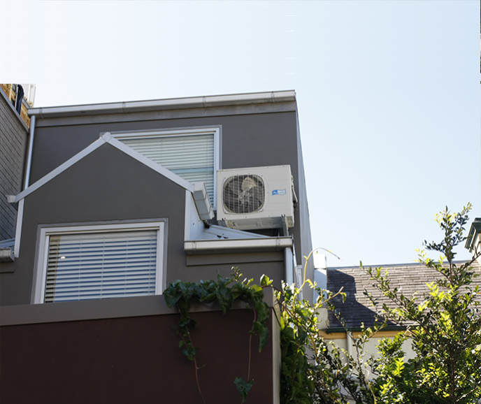 air-conditioner unit on house rooftop