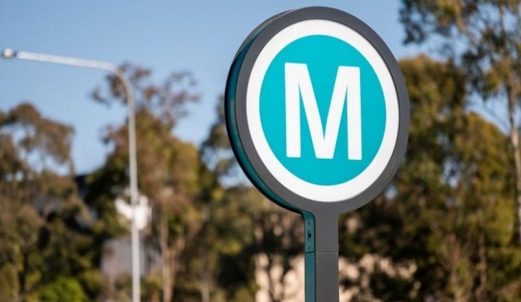 The Sydney Metro sign in the form of it official logo with the letter M.