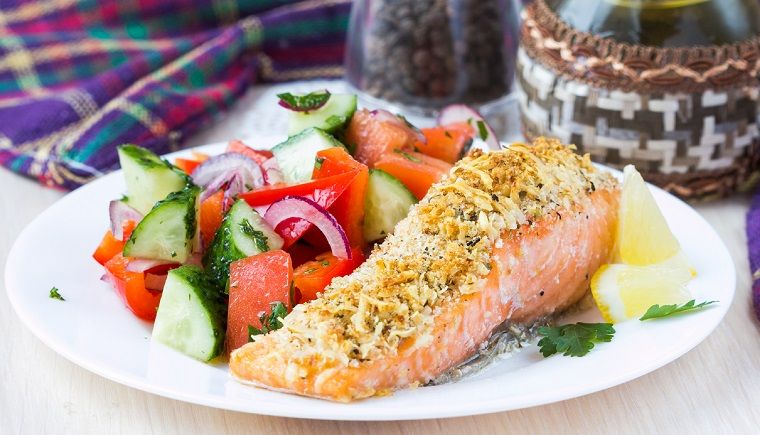Salmon on a plate served with salad