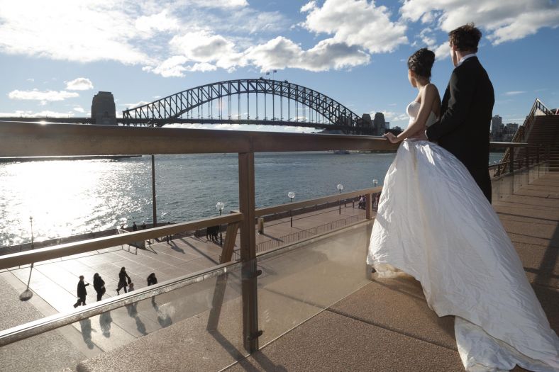 Bride and groom styled photography shot looking towards Sydney Harbour Bridge