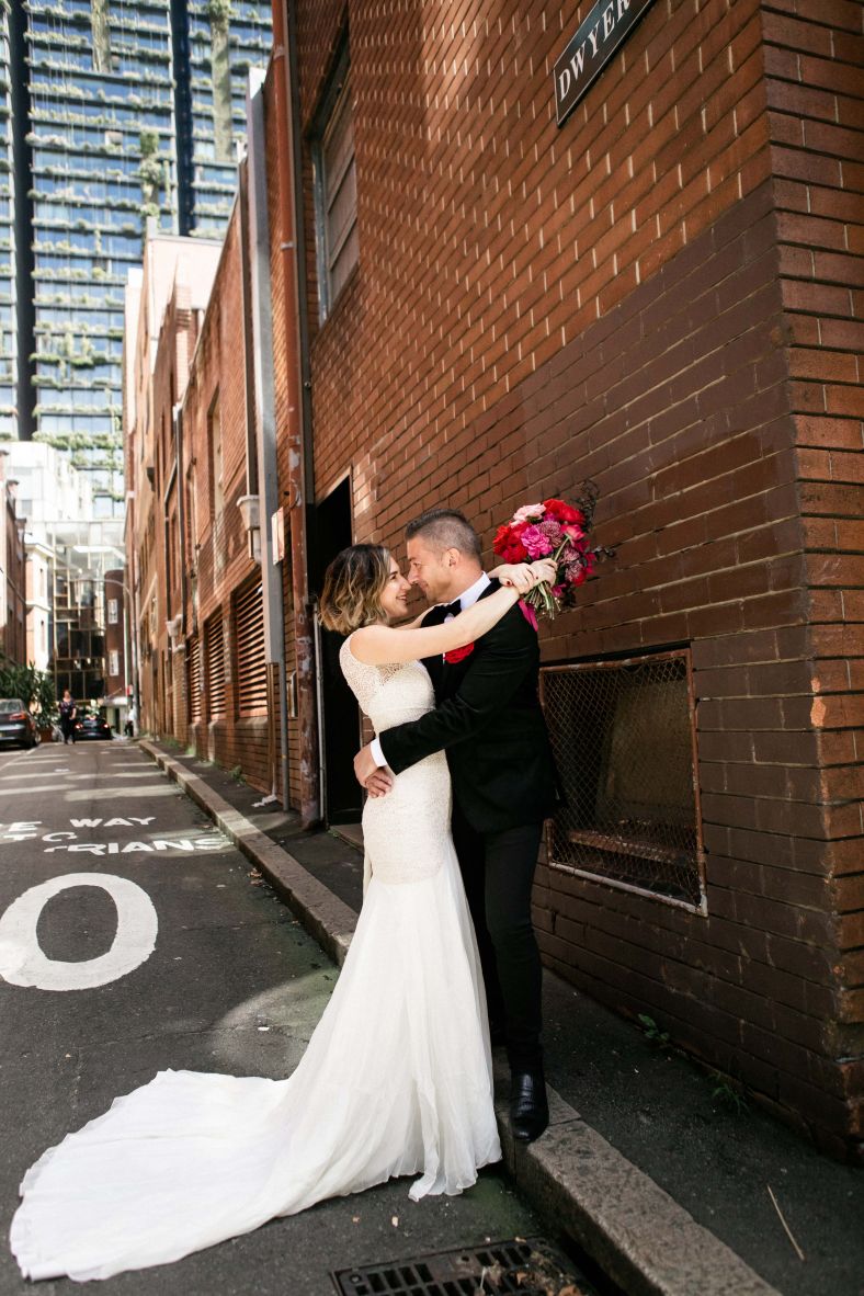 Bride and groom hugging in the laneways of Chippendale