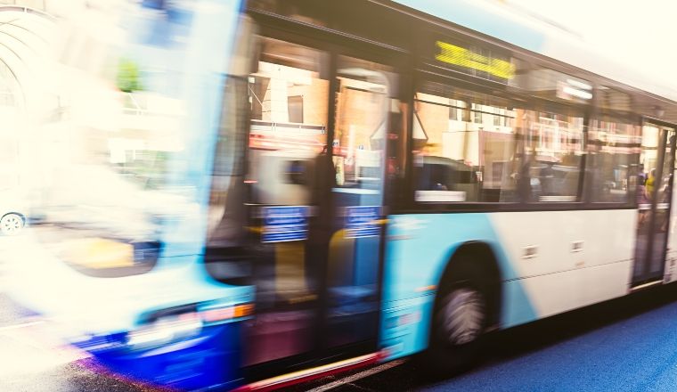 A blurred image of a Sydney bus.