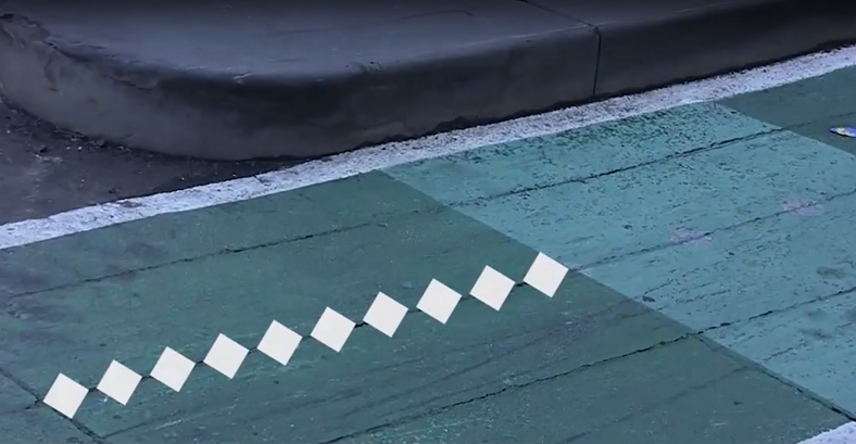 Diamond markings on a bike lane