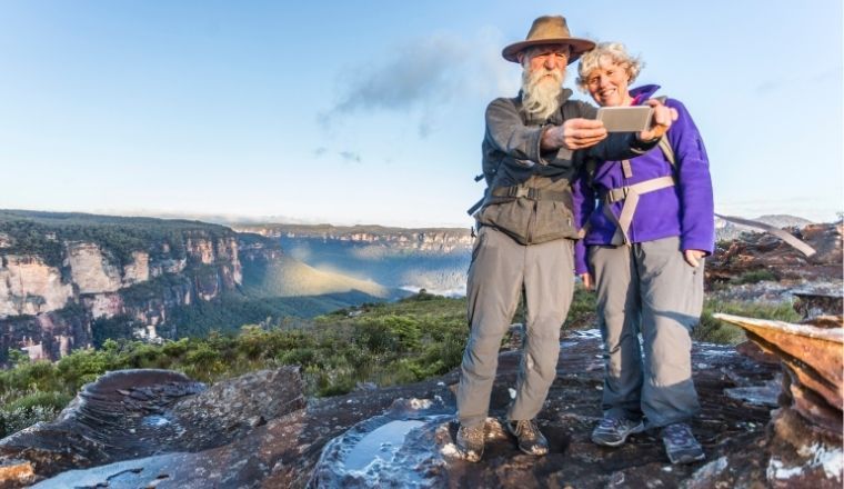 Senior couple taking a selfie while bushwalking in the Blue Mountains in NSW
