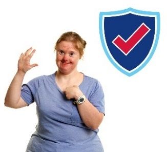 A smiling woman is pointing at herself with the other hand raised. To her right is a safety icon.