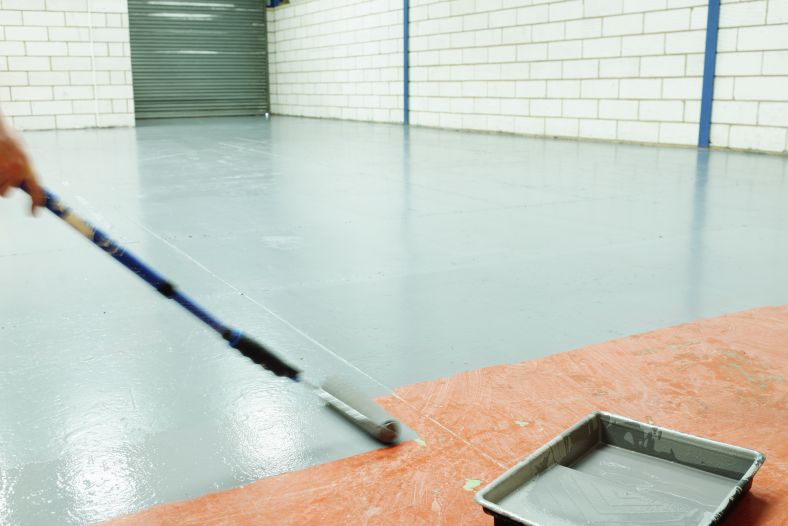Image of anti slip flooring being applied in a workplace.