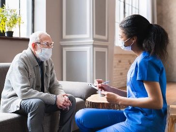 nurse-interviewing-old-man_photo