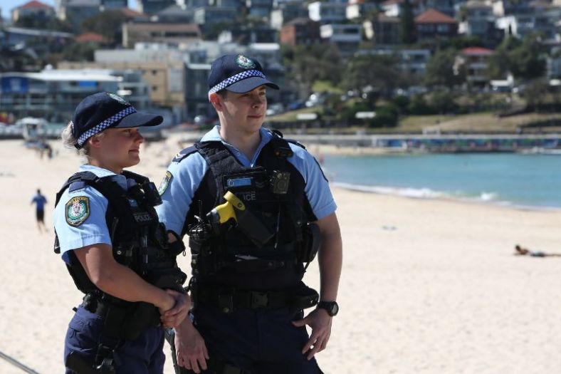 A female and male police officer on a Sydney beach