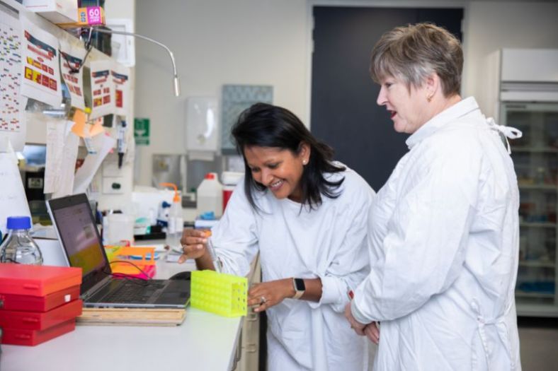 Two female scientists at work in a lab