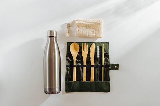 metal drink bottle with bamboo cutlery set, straw and straw cleaner