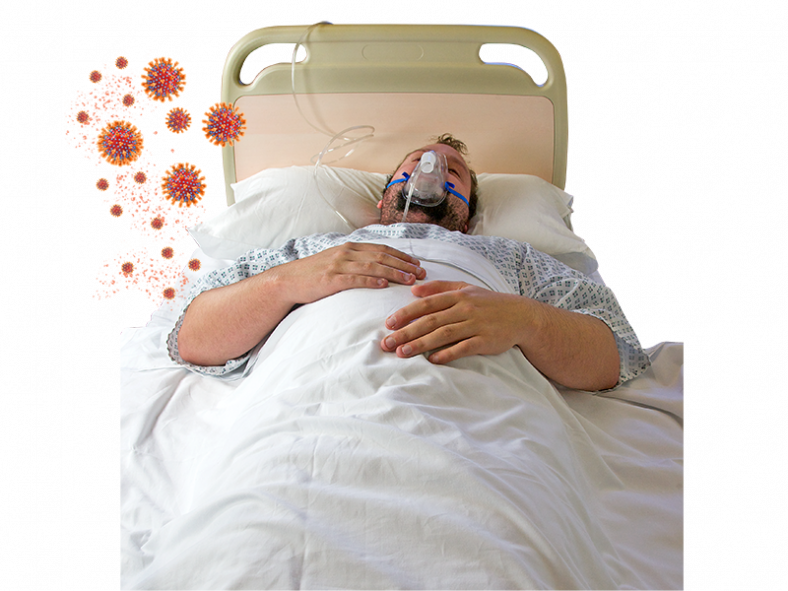 man wearing oxygen mask in hospital bed