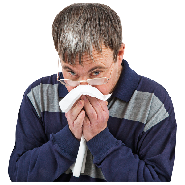 man blowing nose with tissue