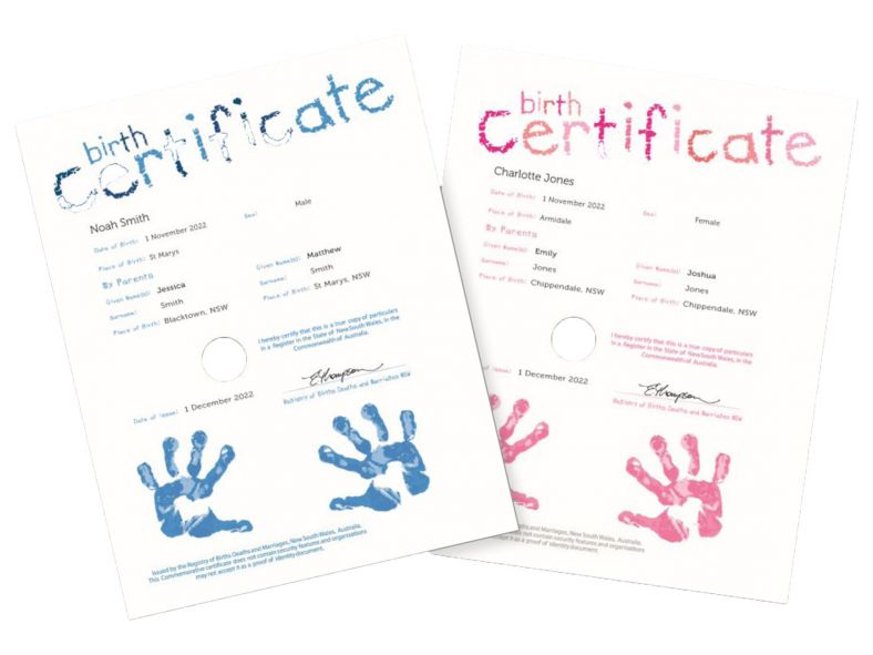 Commemorative birth certificates featuring blue and pink handprints