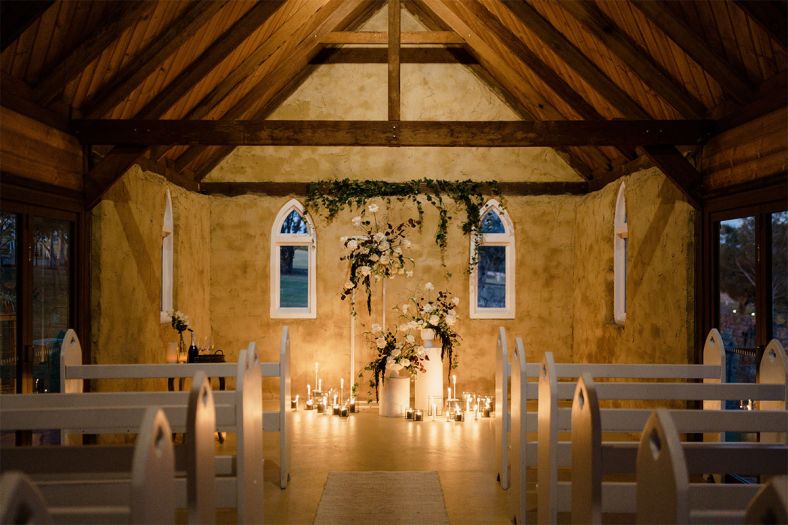 The chapel at Peppers Creek styled with flowers and candels