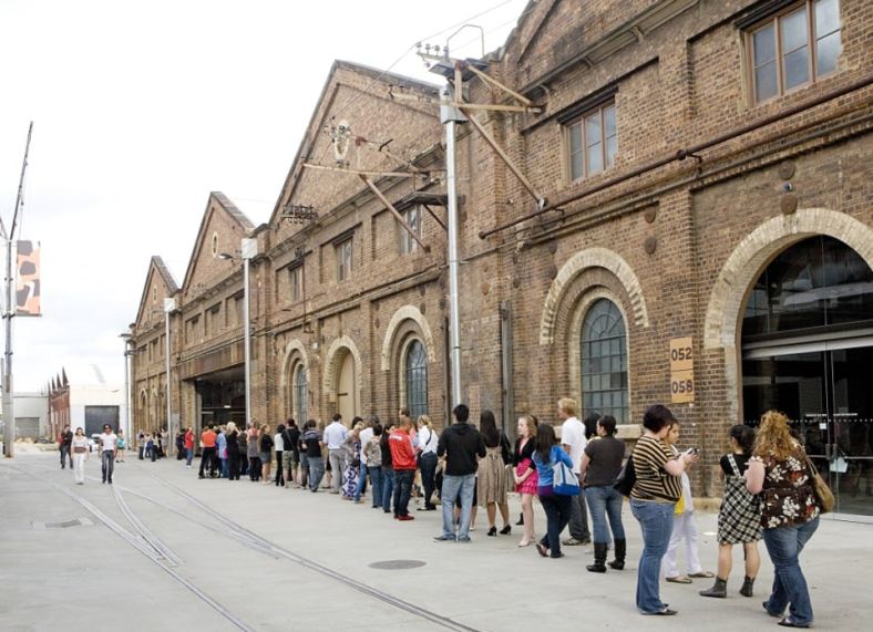 People queueing up outside this art precinct, former heritage brown brick rail depot