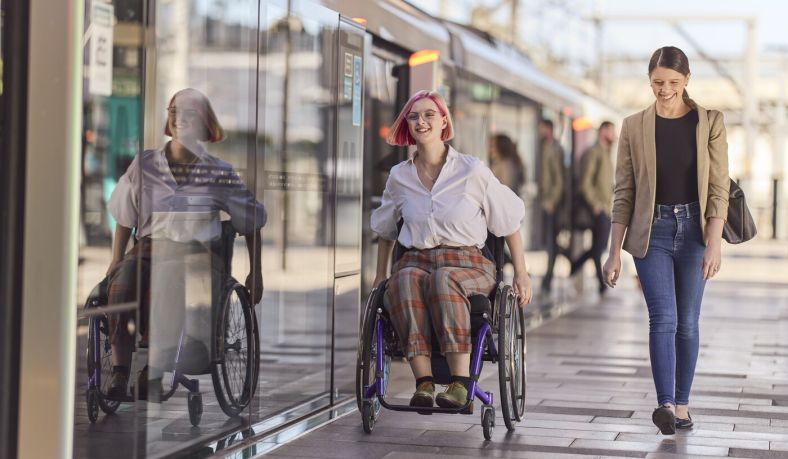 People at accessible train station
