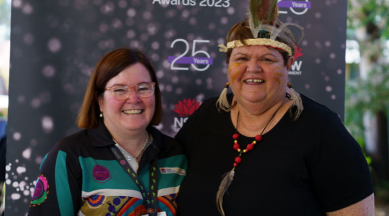 Two Aboriginal health workers pose for a photo