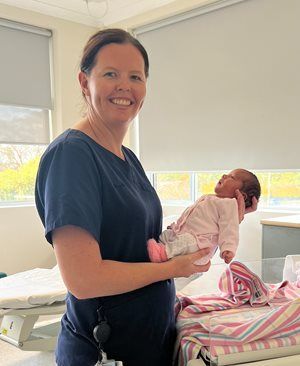 Image of Bianca Jones, holding a newborn baby at Cootamundra Hospital
