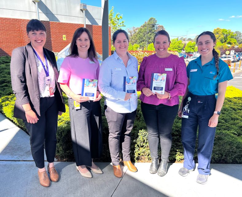 Members of Orange's Allied Health teams show off new patient resource booklet