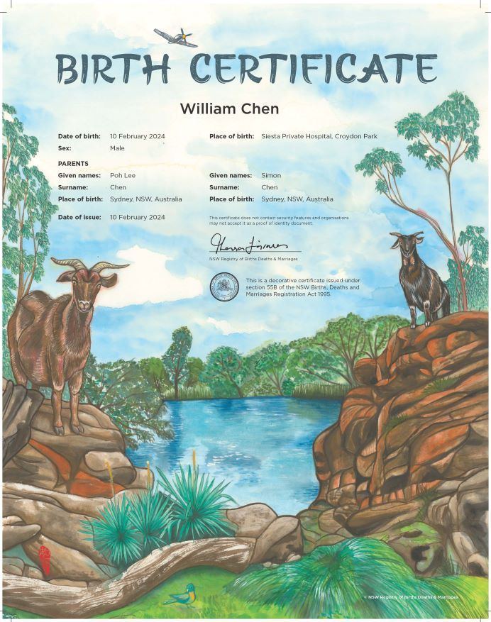 A commemorative birth certificate depicting two goats on the rocky banks of a river