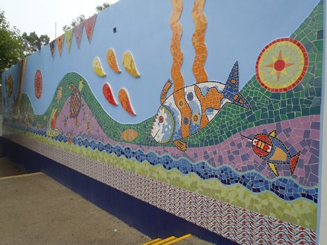 Wall with painted mural of fish
