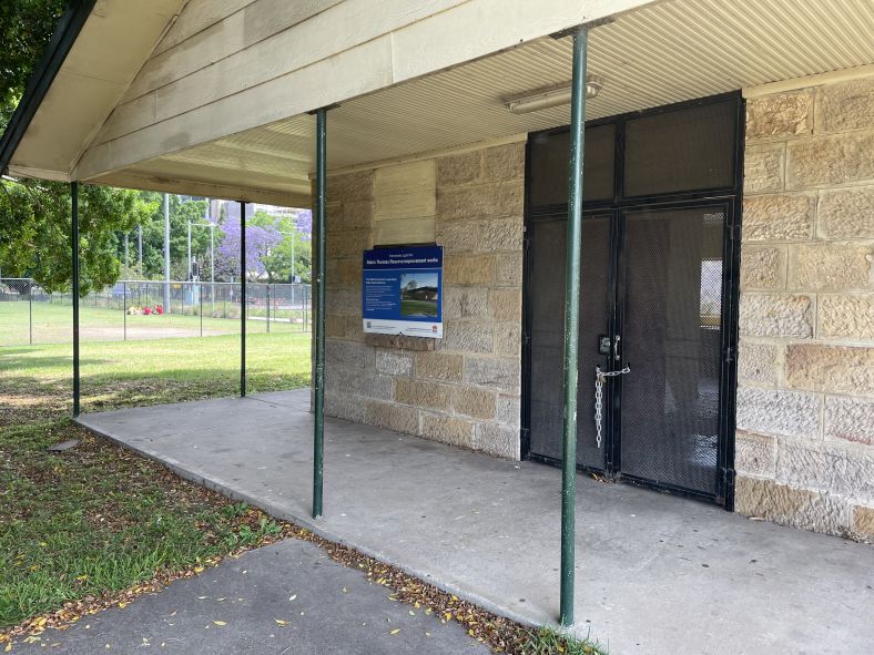 The former clubhouse at Robin Thomas Reserve with a construction notification fixed to its wall