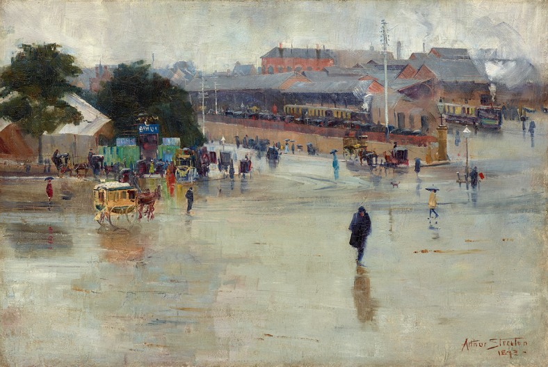 The painting depicts a busy Redfern Station on a rainy day in 1893. In the background, two trains are pulled in alongside platforms, steam escaping from their chimneys. Awaiting passengers holding umbrellas have filled each platform. In the foreground, a large, wide gravel street depicts a small number of horse-drawn carriages and people making their way to and from the station. The figure of a man dressed in black, head down, is depicted walking alone towards the viewer.