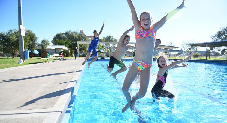 Warren pool with kids jumping in it